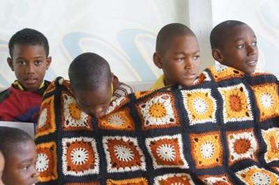 Four Boys from Buckingham School wrapped in wool blanket at Ahhh...Ras Natango workshop